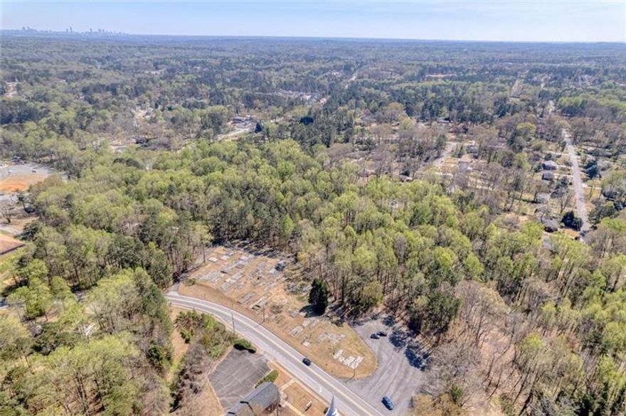 9.5 Total Residential Acres in Marietta Ga, this sale includes 4 lots that total 9.5 acres, lots included are parcel number 19070300580 with 7.1 acres, 959 Old Milford Church Road Parcel number 19070300310 with 1.1 acres, 929 Old Milford church road parcel number 19070300450 with .50 acres, and 969 Old Milford Church Road parcel number 19070300440 with .80 acres. Property is near the corner of Hicks Road, Smyrna Powder Springs Road and Milford Church Road, across from Milford Baptist Church and walking distance to Birney Elementary School. Electrical Power, Cobb County water service, and Natural Gas from Austell Gas, on site at 959 Old Milford Church and 969 Old Milford church, the 7.12 parcel has a sewer easement on the property. Only 6.9 miles to I-75 and 8 miles to the Braves stadium and The Battery. Two homes and a barn on the property which could be renovated or torn down. Property is heavily covered with ready to harvest hardwoods and has a creek running through the property in two locations.