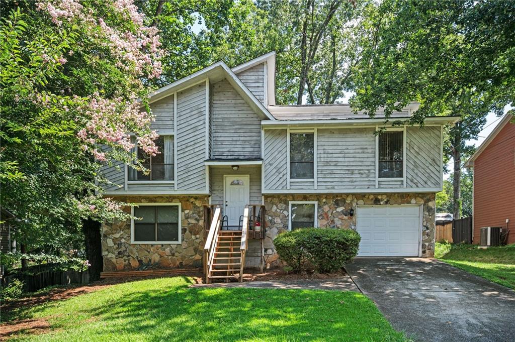 Opportunity knocks in Lilburn! Discover the perfect blend of space, convenience, and potential in this spacious 4-bedroom, 2-bath split-level home that features a flexible floor plan, great for families ready to build their next chapter or savvy investors seeking a smart portfolio addition. Enjoy two outdoor decks—including one brand-new—and a large backyard just right for entertaining or relaxing. Located near dining, shopping, and I-85 with No HOA. Priced below market value to reflect future improvement needs—like flooring and cosmetic updates—this property is packed with possibilities and ready for your vision. Whether you're customizing your dream home or expanding your investment portfolio, this one checks all the boxes. Don't miss out—Schedule your showing today. Seller prefers all potential buyers tour the home prior to putting in an offer to purchase.