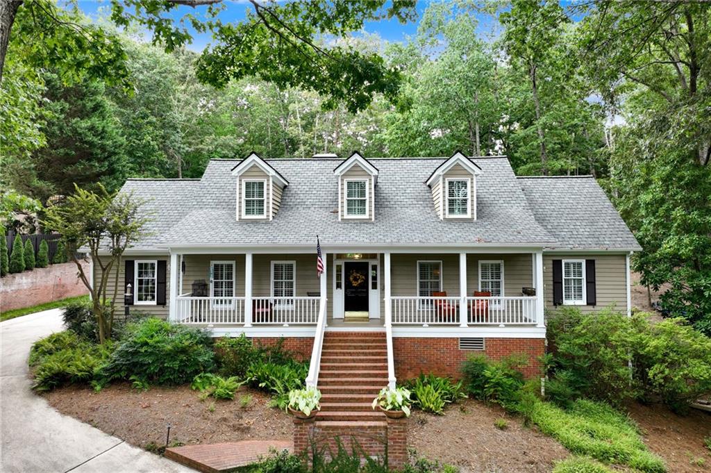 From the inviting front porch to the brick patio, don’t wait to discover this charming 3-bedroom, 2.5-bath home nestled in the desirable North Hall district. Surrounded by a canopy of mature trees and lush landscaping, this property offers a tranquil retreat super close to the lake. The main level offers beautiful hardwood floors, spacious kitchen, living room, dining room, handsome study, and primary suite with 2 closets. Upstairs you’ll find two spacious bedrooms with shared bath and a flex room perfect for bonus room or 4th bedroom. The finished basement adds ample living space, full bath, and enough space to create the perfect in-law suite with separate entrance, while the 2-car garage offers convenience and storage. Above the garage, you'll find an unfinished space with a separate entry—perfect for a home gym, workout room, or even bonus room. The spacious lot includes an additional parcel, providing plenty of room for outdoor activities, gardening, or future expansion. This versatile home combines comfort, functionality, and privacy in a peaceful setting. Exceptional location just minutes to Chattahoochee Country Club, parks and recreation, healthcare facilities, and downtown Gainesville.