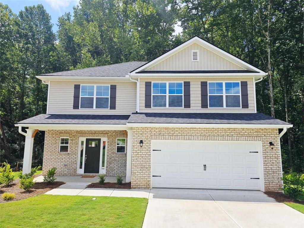 Welcome to "The Hearthwood Retreat" - A Spacious 2131sq ft 4BD/2.5BA Haven in Scarlett Place! cul-de-sac retreat! This two-story home features an open-concept living area, granite countertops with tile backsplash, main-level master suite with separate tub & shower, and a versatile upstairs rec room. Standard features include full sod front & back, 30-year shingles, brick-front exterior, 5 1/4 baseboards (even in the garage), tray ceiling in master, garbage disposal, and more. Covered patio perfect for relaxing outdoors. No HOA, USDA eligible, only $1,000 earnest money! **Price Reflects Builder Incentive**