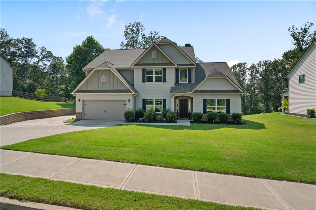 Tucked away on a quiet street in Rydal, 31 Thunderhawk Lane offers a blend of space, design, and comfort across more than 3,000 square feet. Set on a .78-acre lot, this 4-bedroom, 3.5-bathroom home delivers a flexible layout that works whether you're hosting, working from home, or simply enjoying daily life.
The main level features a dedicated dining room just off the foyer and opens to a large living area with a soaring ceiling and a striking stone fireplace. The kitchen is finished with granite countertops, stainless steel appliances, and an island that doubles as a prep station or breakfast bar. A casual dining space sits just off the kitchen with views of the backyard.
The primary suite is also on the main floor and offers privacy along with an ensuite bathroom that includes dual sinks, a soaking tub, separate shower, and a walk-in closet. Also on the main level are a half bath for guests, a laundry room, and access to the two-car garage.
Upstairs, you'll find three well-sized bedrooms and two full bathrooms. One bedroom features a private ensuite, while the other two share a hall bath. A loft area provides a flexible space for a media room, study, or second living area.
Out back, the covered patio includes a ceiling fan for comfort and shade, making it an easy place to relax or entertain. The backyard is wide and open, ready for whatever use fits your lifestyle.
Located just a short drive from Cartersville and I-75, this home offers peaceful living without sacrificing convenience. With thoughtful features throughout and space where it matters, 31 Thunderhawk Lane is ready for its next chapter.
Schedule your showing today.
