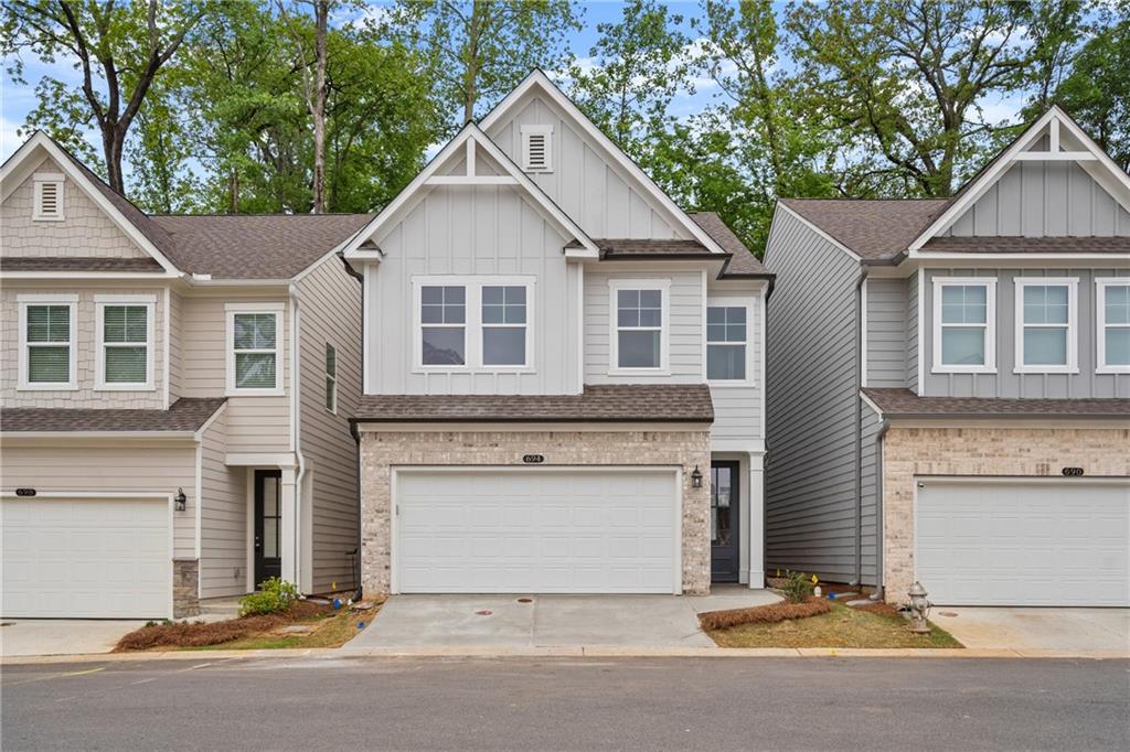 HURRY, FEW HOMES LEFT! Welcome to The Cary A lot 41, a stunning 3-bedroom, 2.5-bath residence in the sought-after GATED Village at Shallowford just steps from pool and clubhouse. This move-in-ready home spans 2,008 sq ft, combining elegance with practicality. The open layout invites you into a bright foyer leading to a gourmet kitchen with 10 FT island, 42” cabinets, gleaming granite countertops, and top-of-the-line stainless-steel appliances.
Relax in the cozy living room, complete with a charming shiplap fireplace and 9 FT ceilings throughout the main level, or entertain guests in the adjoining dining room with easy access to the private patio. Retreat to the oversized primary suite, offering a luxurious extended tile shower and a walk-in closet, providing a peaceful escape from the secondary bedrooms.
Enjoy the open railing staircase that adds a feeling of light and spaciousness and oak treads on the stairs enhance the sophisticated ambiance. Set within the ONLY gated community with a pool and clubhouse in Kennesaw, enjoy quality amenities and proximity to excellent schools. With its charming exteriors and open floor plans, this home is a true gem.
Self guided tours available!
