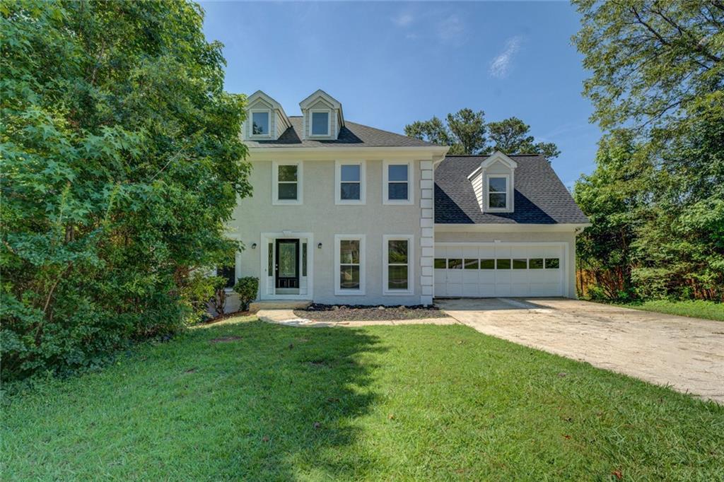 Spacious 2-story home with 4 bedrooms and 2 baths upstairs, a half bath on the main. Master suite has a sep. tiled shower with glass block walls, double vanity, sep tub. The 4th bedroom is larger and opens to the hall bath. Formal Living and Dining rooms, updated kitchen with granite, breakfast area, and overlooking the deck with a look at the large private backyard. The family room has a fireplace and opens to the new deck. The lower level has 2 finished rooms to be used as you wish. There is a large, unf room that is a great space for the mechanicals. There is a 2-car garage. The interior has new flooring and fresh paint. The deck is new. The community has a NON-mandatory hoa, but the community has a pool, golf course, tennis and clubhouse. This one won't last - hurry on and call for your showing.