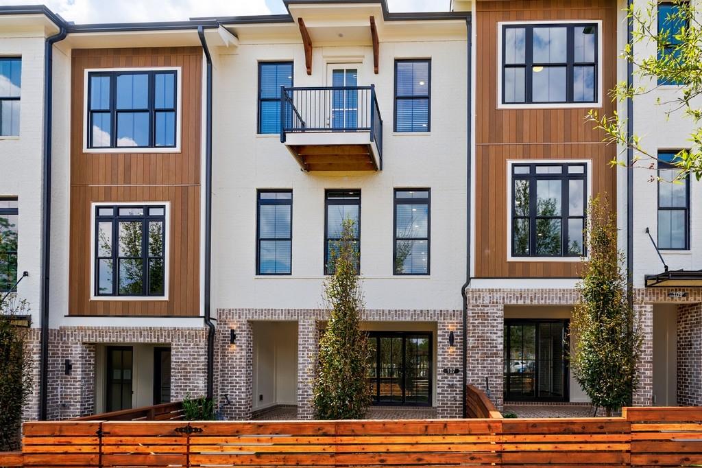 Welcome to your dream townhome where modern design meets community charm! From your front door, you'll enjoy a picturesque view of the park and easy access to the inviting outdoor community fireplace-perfect for gathering with neighbors or unwinding after a long day. Inside, this three-story home offers 3 spacious bedrooms and 2.5 bathrooms, blending style and functionality at every turn. The entry level features a bright, versatile room that opens to a private brick patio-an ideal flex space for a home office, gym, or media room. The main level is the heart of the home, with an open-concept design that flows seamlessly between the living, dining, and kitchen areas. The gourmet kitchen boasts quartz countertops, 42" cabinets with crown molding, premium GE stainless steel appliances, and a large island perfect for entertaining. Step outside to your private deck to enjoy morning coffee or evening relaxation. Upstairs, the owner's suite feels like a retreat with its spa-inspired bathroom and walk-in closet, while two additional bedrooms provide plenty of space for family or guests-one even opening to a second private deck. A two-car garage with EV charging, additional driveway parking, and guest spaces throughout the community make life easy. Best of all, this location puts you just steps away from some of the best restaurants in the city and minutes from Avalon, Downtown Alpharetta, Topgolf, and the soon-to-open Atlanta National Pickleball Club. With quick access to Hwy 400, you can get anywhere with ease. Plus, HOA-maintained landscaping and lawn care give you more time to enjoy the vibrant lifestyle this community offers.