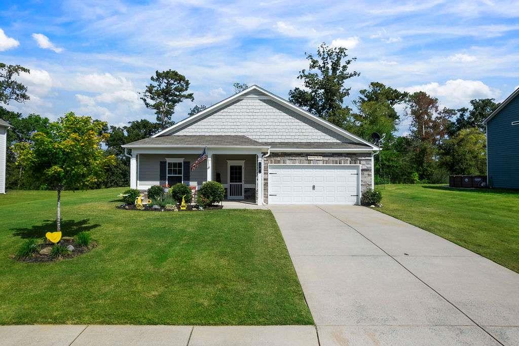 Welcome to this beautifully maintained 3-bedroom, 2-bathroom ranch in the sought-after Woody Farms subdivision of Adairsville, Georgia-a charming small town conveniently located between Cartersville and Calhoun, with quick access to I-75 for an easy commute to Atlanta or Chattanooga. This spacious 1,504 square foot home sits on a well-manicured 0.28-acre lot and offers a thoughtfully designed split-bedroom floor plan with fresh paint inside and out. Step through the private front entry into a welcoming foyer that leads to an open-concept living space featuring high ceilings and a seamless flow from the dining area to the family room. The kitchen includes solid surface countertops, a pantry, and a functional island that houses the sink and dishwasher, along with a small breakfast bar and a view into the family room-ideal for everyday living and casual entertaining. The owner's suite features a tray ceiling, walk-in closets, and double vanities, while the secondary bedrooms-carpeted for comfort-provide their own sense of privacy and space. Additional features include insulated windows, disappearing attic stairs, and a garage with built-in shelving that is both functional and impressively organized. Outdoors, enjoy a covered front porch, raised flower beds, a beautifully landscaped yard with peaceful rural views, and a back patio area perfect for relaxing near the cozy fire pit. This home blends modern convenience with country charm and is ready for you to move in and enjoy.