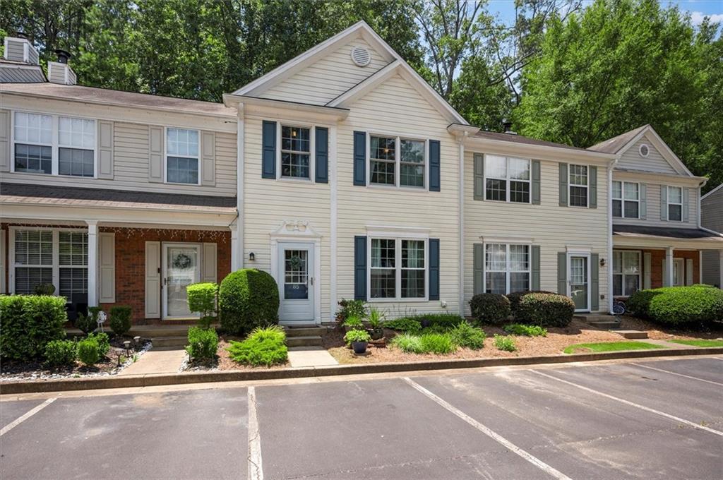 Welcome home to your beautifully updated town home tucked away on a quiet cul-de-sac in the heart of sought-after Johns Creek. This inviting home blends comfort, style, and functionality with an open floor plan featuring thoughtful upgrades throughout. Step inside to discover a bright and airy layout featuring brand-new windows in 2020 that fill the home with natural light. Large family room with a fireplace for relaxing. The kitchen has granite counter tops, soft close cabinets and drawers and bathrooms boast soft-close cabinets and drawers as well, a perfect blend of luxury and practicality. Dining area leads to the gorgeous patio. Upstairs, you’ll find new tile flooring in the bathrooms, enhancing both durability and design. Step outside and unwind in your own private oasis—an enchanting back patio garden ideal for relaxing mornings or entertaining under the stars.With its peaceful location, modern upgrades, and move-in-ready condition, this home offers the perfect combination of tranquility, location and convenience.