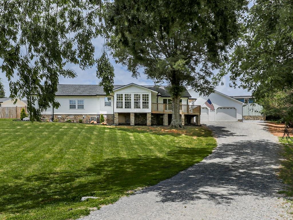 Sellers offering 10k in buyers closing cost. This beautifully renovated home has been completely updated from top to bottom-no detail was overlooked. In addition to cosmetic upgrades, there is a new roof, septic system and field lines, all new plumbing, water heater, and electrical. Start your mornings on the charming front porch, taking in picturesque views of rolling hills and fishing pond, just outside your front door. In the evenings, relax in the refreshing inground pool or unwind beside the stone fireplace under the spacious covered patio. Need room for a large vehicle or recreational equipment? The attached two-car garage features impressive 15-foot ceilings, offering ample space for all your needs. Move-in ready and ideally situated in a peaceful country setting, yet just a short drive from shopping and amenities. Don't miss this exceptional opportunity-schedule your showing today!