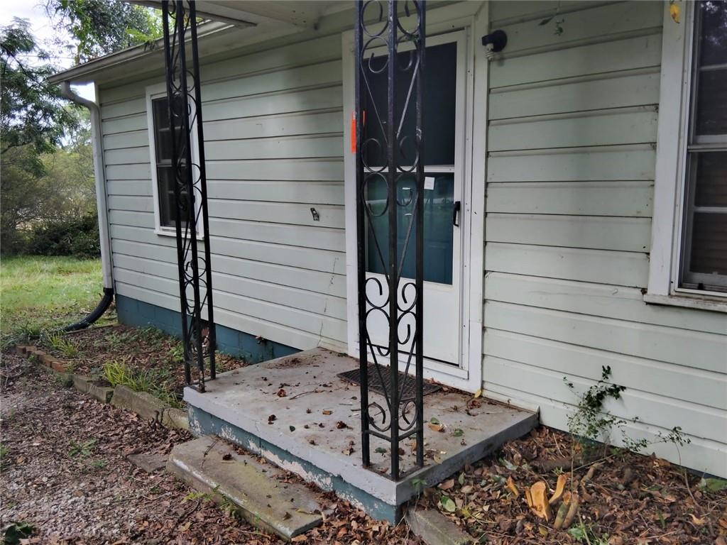 2/1 House is in a quiet neighborhood, grassed, and on one acre touching road frontage. Interior well-kept and clean, septic needs updated repair. priced to sell, roof intact (about 9 years old). Do some TLC to get a great rental or first-time home. accepting offers