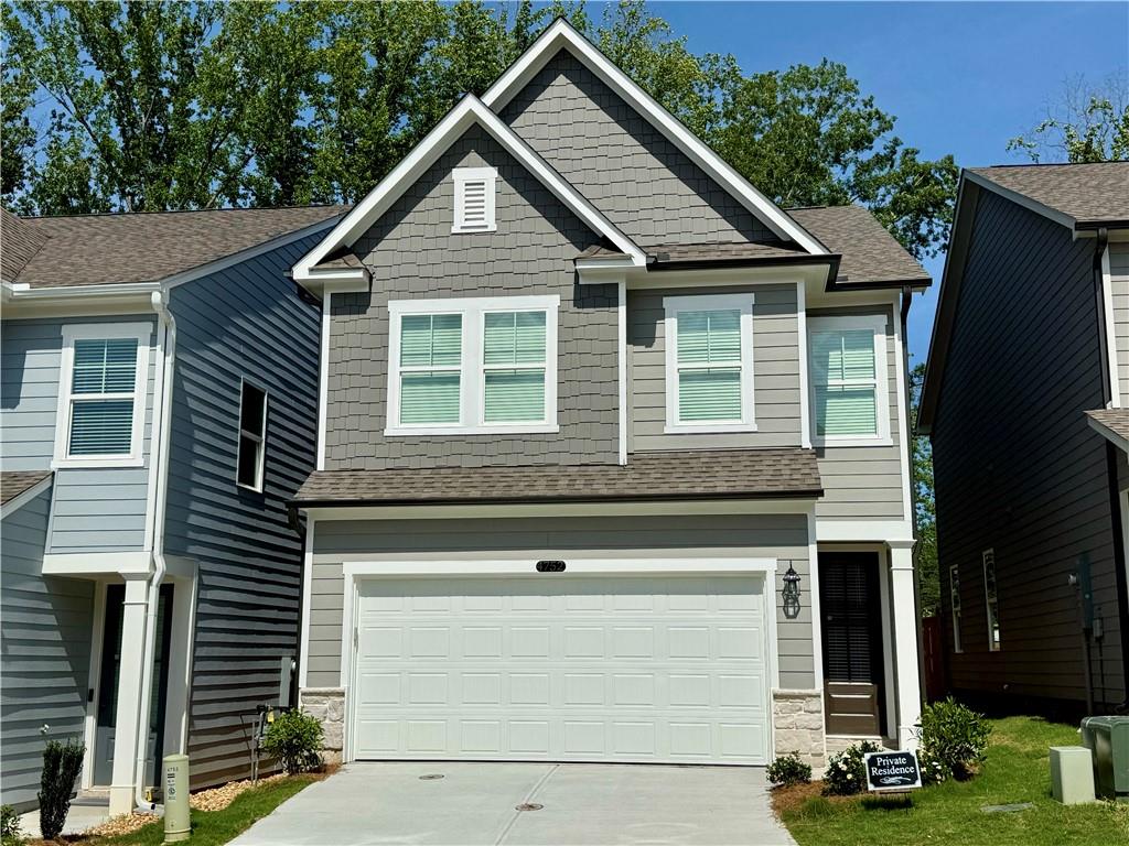 Be the first to live in this brand new construction home located in the gated community of The Village at Shallowford, just 2 miles from Downtown Woodstock, Kennesaw State University (KSU), shopping, dinning, parks, and easy access to I-75, I-575, and Hwy 92. This spacious 3 bedroom, 2.5 bath single family home features the Marion floor plan, with iron art handwheels throughout. This home features open- concept main living area, a beautiful electric decorative fireplace in the family room, luxury vinyl plank flooring on main level, carpet in bedrooms, tile in bathrooms & laundry. Oversized primary suite with large walk-in closet, spa-style primary bath with walk-in tiled shower, all bathrooms include light gray cabinetry and double vanities. Two spacious secondary bedrooms with large closets. Gourmet kitchen includes: 42" cabinets, sleek quartz countertops, stainless steel appliance, and refrigerator. The backyard backs up to a wooded area for added privacy, gated entry & community pool access. Move in ready!!