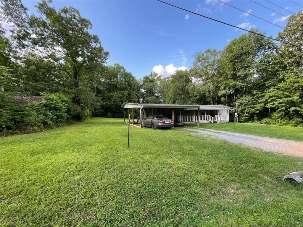 Tucked at the end of a peaceful dead-end road, this inviting home offers privacy, space, and charm in the Armuchee School District. Step onto the covered front porch or relax out back on the spacious deck, surrounded by a beautifully sized yard perfect for outdoor enjoyment. Inside, the home boasts updated flooring and a refreshed bathroom, creating a modern, comfortable feel. Currently rented at $700/month, the lease is now month-to-month, and the tenant is interested in staying- if possible, making this an excellent opportunity for investors or those seeking a quiet, move-in-ready home. Please note: tenant is a day sleeper, so 24-hour notice is required for all showings.