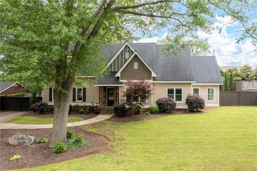 Must see this unique craftsman style home customized with quality trim, exposed beams, shiplap wall, trey ceilings, recessed lighting - upgrades throughout. Six bedrooms and four full baths! Gourmet island kitchen features large island with quartz countertops, ss appliances, oversized refrigerator & freezer, brick backsplash, double oven, gas stove, pot filler faucet, custom walk-in pantry, abundant white cabinetry, coffee bar, wine fridge, ice machine, and breakfast bar.  Master suite includes hardwood floors, trey ceiling, recessed lighting, barn door to lavish bath with double vanity, tile floor, garden tub, huge tile shower with dual multi-head shower sprayers, large walk-in closet and a multi-purpose room off the master bath. Separate dining room w/wainscoting. Entry foyer w/tongue and groove ceiling. Family room with fireplace. Hardwood floors throughout with the exception of some bedrooms. Quality finishes in all baths. Laundry room with built-ins, (washer & dryer to remain). Detached 2-car garage. Tankless hot water heater. Large patio and veranda! Home has a privacy electronic gate on the driveway. Convenient location, closing to shopping, dining, and I-75.