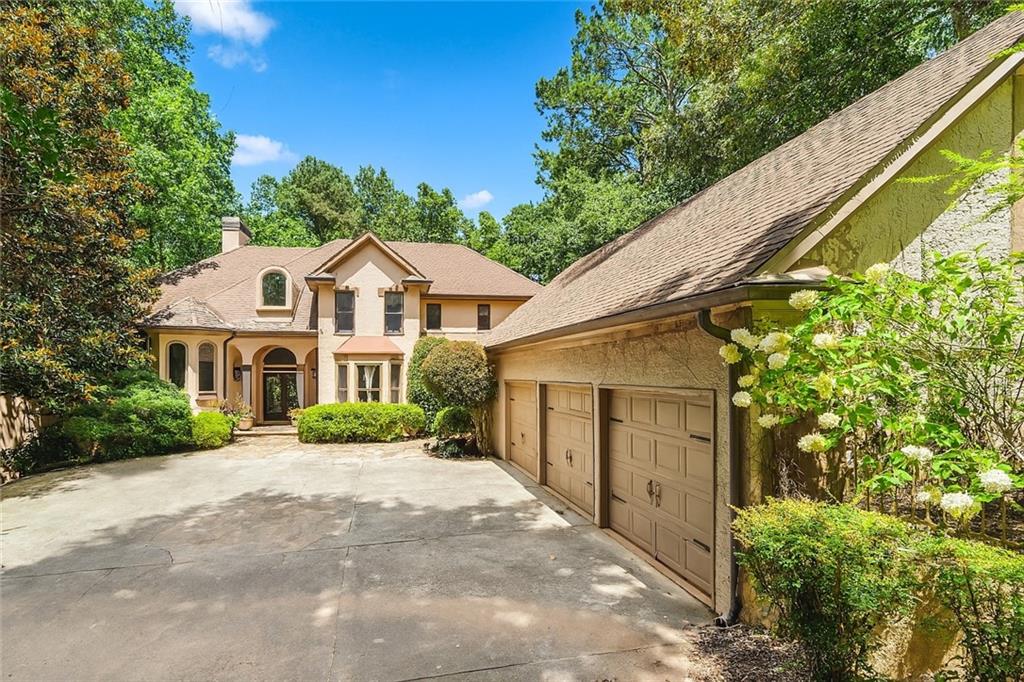 Welcome to a rare blend of luxury, comfort, and natural beauty—nestled on 1.3 private, manicured acres with panoramic views of the 5th hole and fairway of the prestigious Towne Lake Hills North Golf Course. This stunning traditional home offers a lifestyle of serenity and sophistication, where every detail has been thoughtfully designed for both relaxation and entertaining.
As you approach, the peaceful charm of the front courtyard sets the tone. Picture yourself sipping morning coffee to the soft sound of a bubbling fountain, while watching golfers pass and deer wander nearby. This tranquil space, coupled with a sparkling heated pool in the backyard, creates the perfect backdrop for everyday peace and unforgettable gatherings.
Step inside and immediately feel the warmth and openness of the main living areas. A wall of windows floods the space with natural light and draws your eyes to the breathtaking views of the sand trap, trees, and rolling greens. The open-concept floor plan connects the living room seamlessly to the expansive deck, ideal for hosting or simply enjoying the stillness of nature.
The heart of the home—the gourmet kitchen—is a dream come true. Featuring a massive island perfect for family meals or entertaining guests, this space flows effortlessly into the cozy breakfast area and keeping room with fireplace. Whether you're hosting holiday dinners or enjoying casual weekends, this kitchen will become your favorite gathering spot.
Retreat to the luxurious main-level owner’s suite, a peaceful sanctuary complete with a sunken sitting area and private views of the golf course and surrounding landscape. Unwind in the spa-like en-suite bath and wake up every morning to views that inspire calm and clarity.
Upstairs, three generously sized bedrooms each offer their own private bathroom, giving everyone their own space and comfort. On the lower level, the fully finished terrace expands your living and entertaining possibilities. A large family room with wet bar is perfect for game nights, movie marathons, or weekend fun. You’ll also find a workout room, billiards area, and three flexible rooms ideal for guest bedrooms, offices, or creative studios.
The 3-car garage includes a hidden gem—an unfinished carriage house above with plumbing and electrical already in place, offering potential for a guest suite, studio, or income property.
As part of the vibrant Towne Lake Hills community, you’ll have access to resort-style amenities including tennis courts, a pool with waterslide, gym, playground, clubhouse, restaurant, and optional golf club membership. Whether you're an avid golfer, a nature lover, or someone seeking peaceful luxury in a thriving neighborhood, this home offers it all.
Come experience the lifestyle you’ve been dreaming of—every day feels like a getaway in this extraordinary home. Schedule your private tour today!