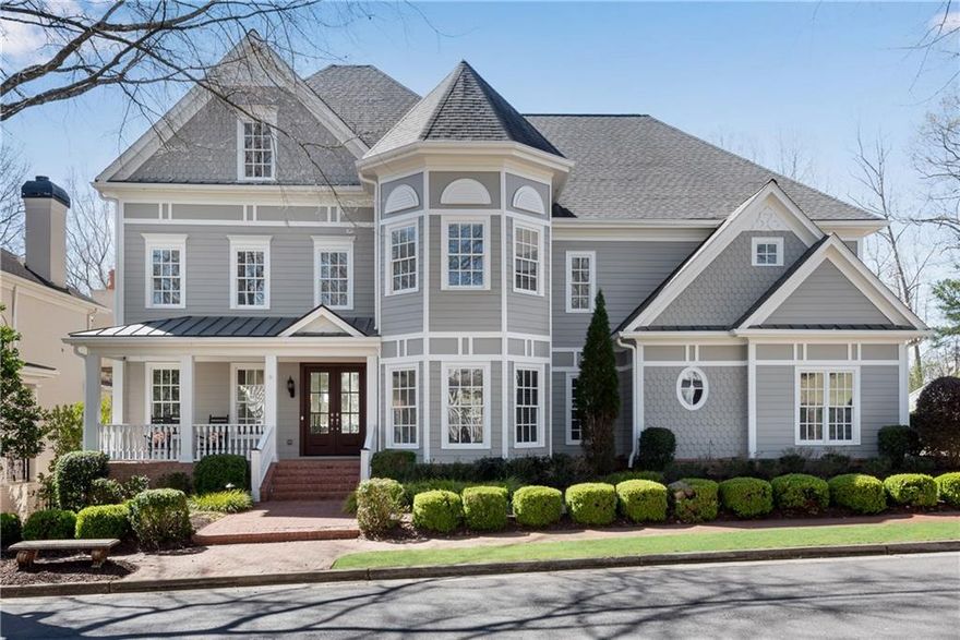 Stunning custom-built home situated on a gorgeous lot in the highly sought-after, gated community of Ellard! Main level features 10' ceilings and light-filled, open floor plan. Breathtaking two-story great room with a stacked stone fireplace and wall of windows. High-end kitchen features stainless steel appliances, including a Sub-Zero refrigerator and a 6-burner, gas Viking range. Picturesque breakfast room has windows on three sides and a glass door that leads to a large Trex deck. Bedroom suite with full bath on main level, plus additional powder room on main. Upstairs, luxurious primary suite has a cozy fireplace, large sitting area, and its own private balcony. The suite also includes two large walk-in closets, glass shower, soaking tub, matching vanities, and private water closet. Three large additional bedrooms upstairs, each with its own bathroom. Huge terrace level has a workout room, complete with mirrored wall, mat flooring, and sliding glass doors. Large movie/entertainment room, plus another large room perfect for gaming, foosball, and pool table with direct access to the backyard. Terrace level bedroom is perfect for guests or private office. Full bathroom. Stunning $350,000 backyard renovation created a serene paradise, perfect for enjoying life with family and friends. Gorgeous gunite pool, spa, and waterfall! Extensive landscaping and hardscaping include a putting green, beautiful stone retaining walls, a large patio perfect for sunbathing, mature trees, and flowering bushes. The outdoor area also includes a covered area and an outdoor kitchen with granite counters, gas grill, and refrigerator. Spacious three-car garage. Ellard community includes acres of common green space and walking trails, a clubhouse, pool, tennis courts, playground, and security on duty 24/7. Minutes from downtown Roswell,  Alpharetta, and Peachtree Corners with all their restaurants, shopping, and great private schools! Easy access to 400 and I-85.