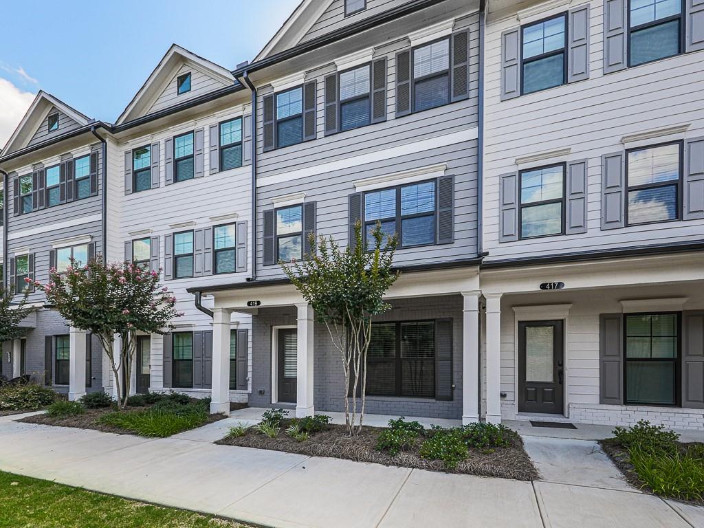 Rest easy in this Prime Location! Nestled between downtown Woodstock and Roswell, this home offers a short drive to both Hwy 575 and 400. Enjoy easy access to major shopping centers, restaurants, recreation areas, and fitness facilities and of course- fantastic Cherokee County Schools! This stunning, nearly new townhome features 3 bedrooms and 3.5 bathrooms, with served by it's own private bathroom. The luxury offers high ceilings, an open floor plan with desirable modern finishes, and plenty of natural light. The chef's kitchen includes an oversized island, beautiful 42" cabinets, and stainless steel appliances. For outdoor living, there is a large covered deck, ideal for relaxing or entertaining. Enjoy the safety and security living within this gated community. HOA covers lawn care, exterior maintenance including the roof, and trash pickup.
