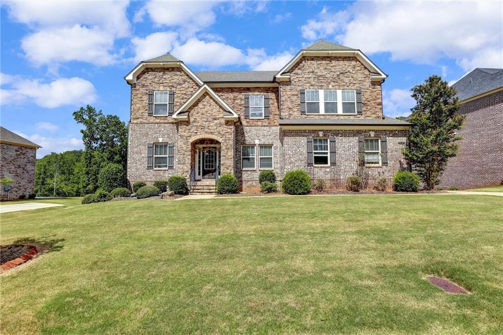 Welcome to Your Dream Home in Woodland Reserve!
This better-than-new, North East-facing, energy-efficient smart home—built in 2018—offers 4,800 sq ft of thoughtfully designed living space on a nearly one-acre, stream-backed lot. With 6 spacious bedrooms and 5 full baths, it provides the perfect blend of luxury, comfort, and functionality.
Step inside to find a chef’s kitchen featuring stone countertops, double ovens, and a walk-in pantry, all seamlessly connected to a sun-drenched two-story great room. The luxurious owner’s suite boasts a private sitting area and a spa-inspired bathroom for the ultimate retreat.
The finished daylight basement offers incredible versatility—ideal for an in-law suite, home theater, or private gym. Outside, enjoy peaceful mornings and evenings on the lighted upper deck or lower patio, overlooking a beautifully landscaped garden and serene stream.
Designed with spray-foam insulation and smart-home technology, this home is both stylish and energy-efficient.
Perfectly located just minutes from top-rated schools (Haw Creek, Lakeside, South Forsyth), GA 20/Exit 14, Northside Hospital, and premier shopping and dining, this is Cumming living at its finest.
Don’t miss the opportunity to make this exceptional property yours!