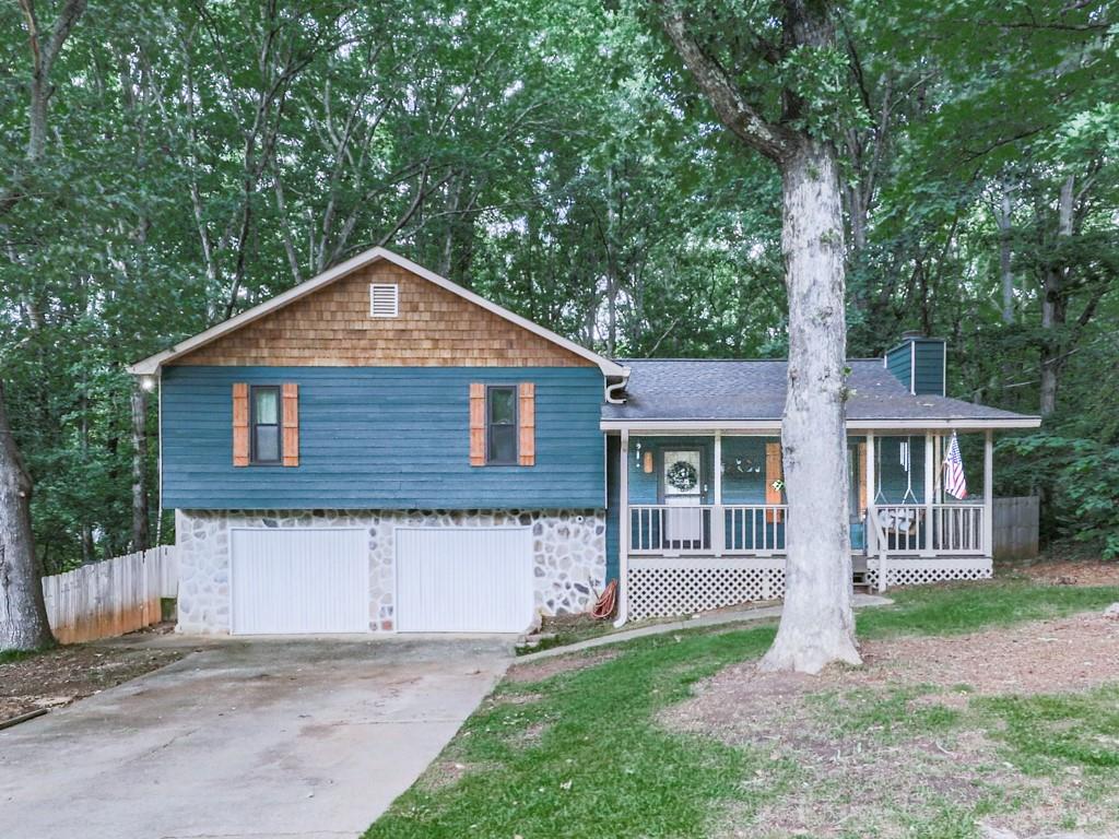 Welcome to this beautiful 3 bedrooms, 3 full bathrooms home. Situated in prime location, 10 minutes from Downtown Woodstock! Offering ideal blend of style and convenience. This non-HOA offers bright and open layout. Great size bedrooms! Eat in kitchen with large room off the back, great for a dining room table or playroom or even office! Great for entertaining. Newer floors! Basement was finished with full bathroom, laundry room, and used as a rec space. Private yard, nice and flat and fenced! Great for gatherings or gardening or simply relaxing. Enjoy the cozy front porch! Woodstock home under $400K!!! Come and check it out.