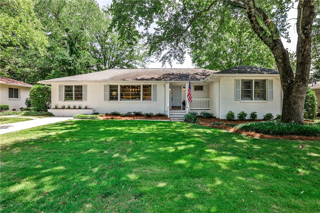 Beautifully renovated 2BR/2BA ranch in Historic Marietta just 1 mile from Marietta Square! This charming painted brick home blends classic character with modern updates, including renovated kitchen with island, renovated en suite primary bath, walk-in closet, renovated guest bath, bonus room (which could be converted into a third bedroom) & hardwood floors throughout. Recent upgrades: new HVAC (2022), new sewer line (2023), privacy fence (2023), plantation shutters, updated lighting, and a new mailbox (2024). The spacious backyard features a large deck, grilling area, and covered patio—perfect for entertaining. Enjoy walkability to restaurants, shops, and year-round events at the Marietta Square!