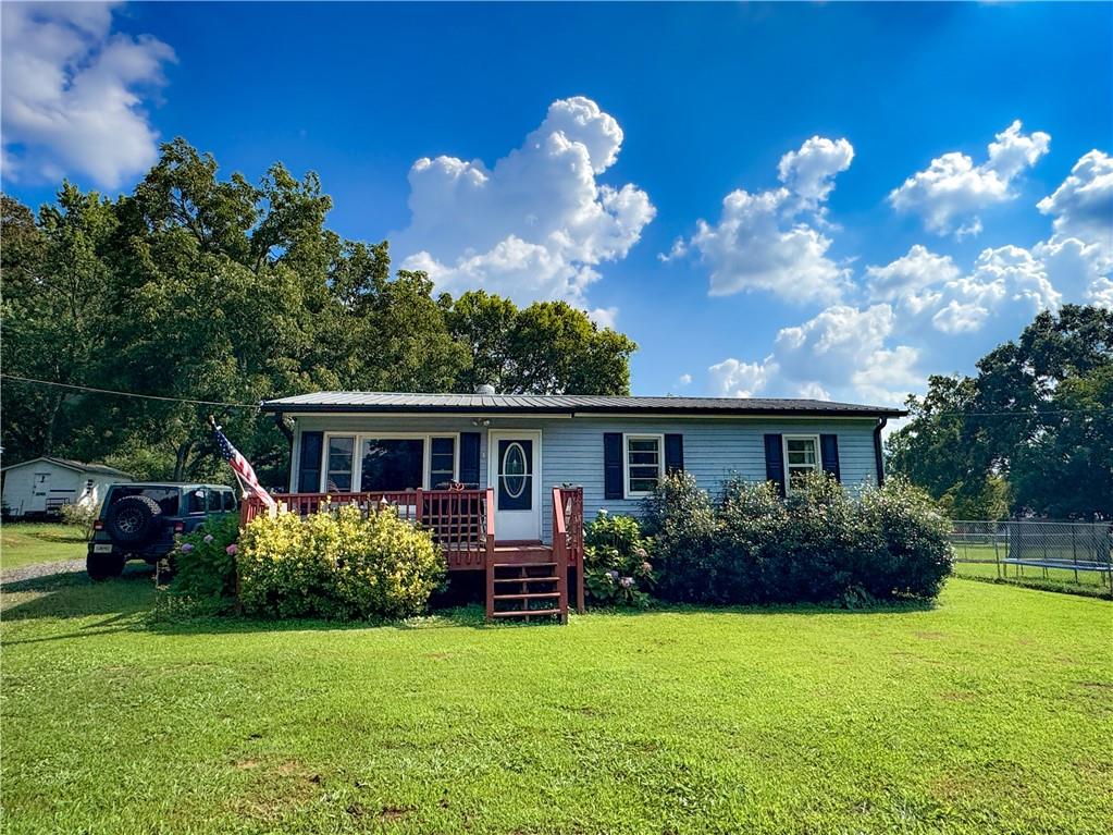 MOTIVATED SELLER Discover serene living in this Charming Ranch Style Home which is located in the Heart of Fairmont where everything is just minutes away from home. This 3 bedroom, 1 bath home offers comfortable living inside and out. This home features an open concept floor plan, a large eat-in kitchen, plenty of cabinet space with view into the family room, and spacious bedrooms. This charming home features a large level lot, the backyard is fenced with two storage sheds for working on projects or for additional storage. The location is convenient as well: only 20 minutes to Waleska or Jasper and 15 minutes to Calhoun Interstate 75 is just around the corner yet enjoying small-town living. NO HOAs