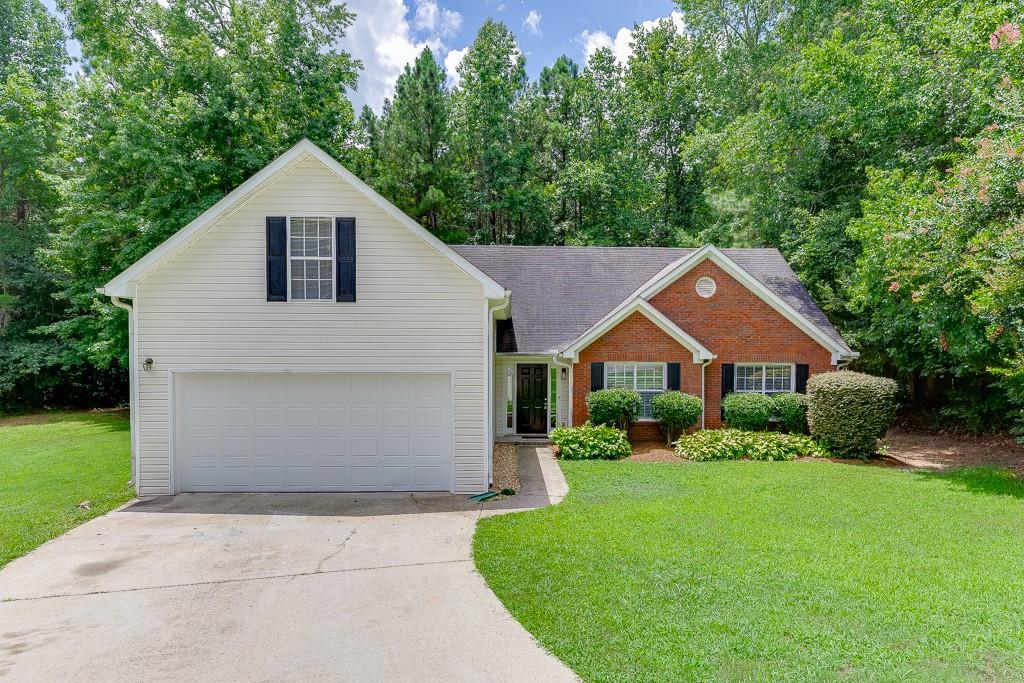 Stunning one-level ranch home located in a highly sought-after Seckinger school cluster! This move-in ready property features fresh interior paint and low-maintenance flooring throughout. The spacious family room offers vaulted ceilings and a cozy brick fireplace, perfect for relaxing evenings. A separate formal dining room adds space for entertaining. The kitchen boasts granite countertops, stainless steel appliances, a pantry, and a bright breakfast area. The oversized primary suite includes vaulted ceilings, a double vanity, garden tub, separate shower, and a walk-in closet. Two additional bedrooms share a full hall bath, and a bonus room provides flexibility for a home office, playroom, or guest space. A generous laundry room adds convenience. Enjoy the large, level backyard—perfect for outdoor fun—located on a quiet cul-de-sac lot. Conveniently situated off Sardis Church Road, with easy access to I-85, Spout Springs Rd, Thompson Mill Rd, Hamilton Mill, parks, schools, and more! ***We DO NOT list rentals on Craigslist nor Market place. Only communicate with The Gwin Team, beware of rental scams - this house is professionally listed by The Gwin Team, ONLY speak with a member of The Gwin Team***