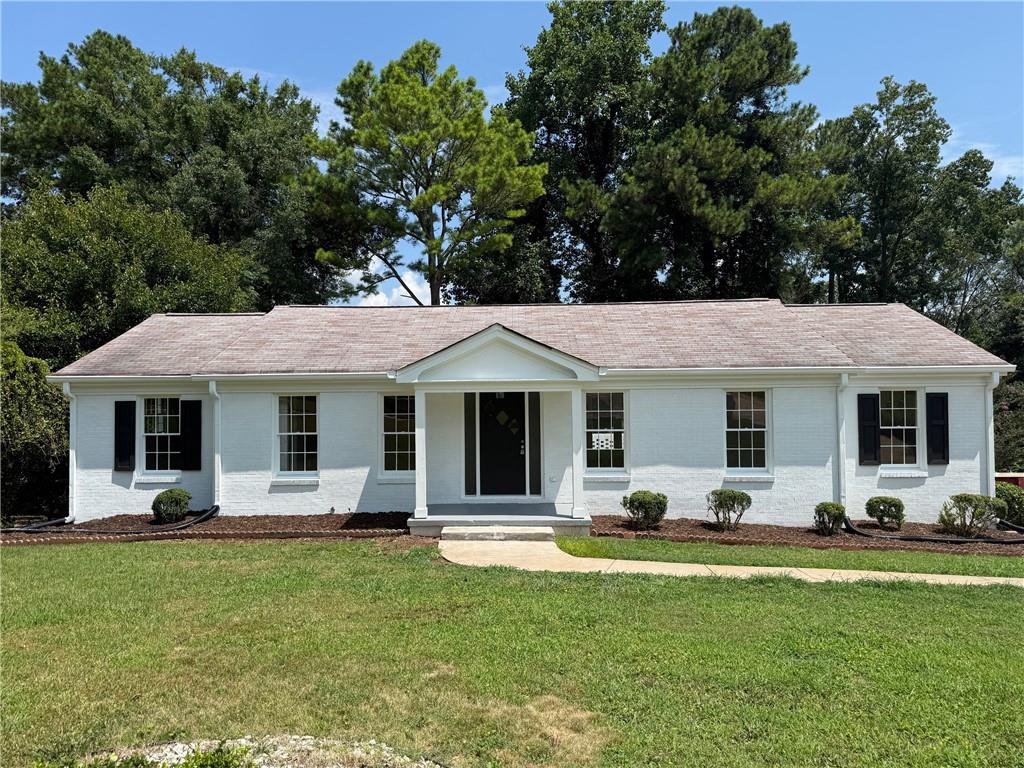 Timeless charm meets modern comfort in Decatur. Filled with abundant natural light, this inviting, 4-sided brick ranch home features several updates and is ready for you to call it yours. Step through the refinished entryway onto the beautiful hardwood floors which are found throughout the home. The open concept floor plan allows for easy flow between the living and dining spaces, perfect for entertaining. Recently updated with luxurious granite countertops that exude sophistication, this kitchen boasts new cabinets and gleaming stainless steel appliances that add a touch of contemporary style. Adding further to the bright and crisp ambiance is new lighting and fresh paint inside and out as well as new electrical, new plumbing and new bathrooms. The full unfinished basement offers an excellent opportunity to create an additional living space and customize as you choose. Enjoy the spacious backyard within the enclosure of a newly installed privacy fence offering generous space for a play area, green space, or a firepit, if desired. Located in a peaceful neighborhood with easy access to shopping, dining, and major highways, this home offers both convenience and comfort.