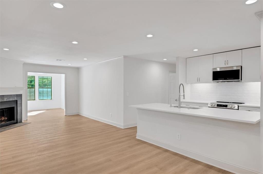 Completely renovated upper-level unit with a beautiful open floor plan! Perfect roommate layout with brand new flooring, new cabinets, quartz countertops with a huge kitchen island, sunroom, deck and fully remodeled bathrooms. Set in a beautifully wooded complex with plenty of green space; conveniently close to I-400, downtown Sandy Springs, North Springs Marta station, Morgan Falls Park, Chattahoochee River, Greenway and downtown Roswell.