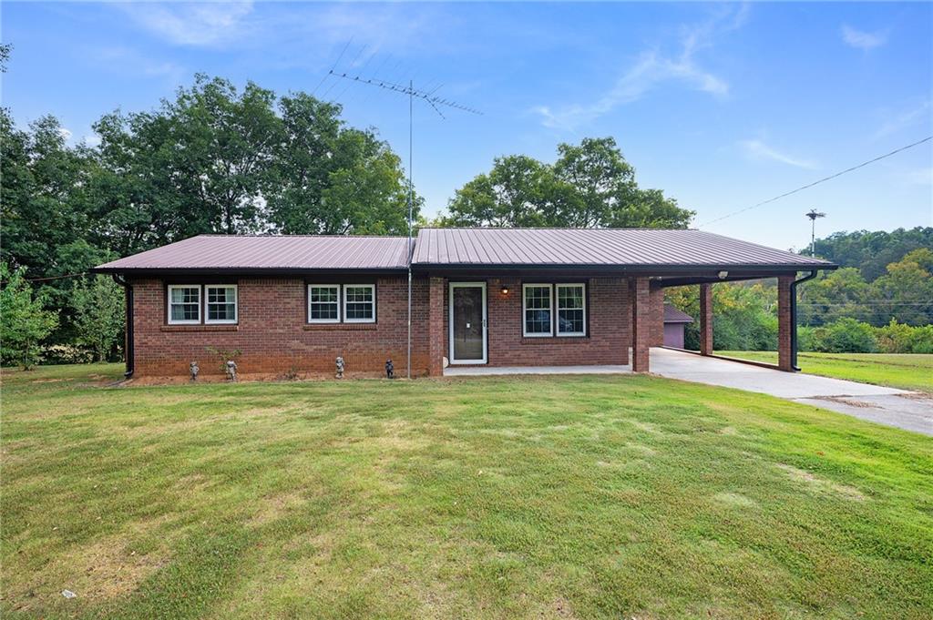 Nestled in a peaceful country setting, this well-maintained 3-bedroom, 2-bathroom home offers timeless charm. Built in 1983, the home retains its original character with important improvements, including updated insulated windows, HVAC, water heater, and septic field lines—ensuring peace of mind for years to come. Inside, the floor plan provides space for comfortable living and an opportunity for personal updates to reflect your style. The property’s outdoor features shine, with a storage shed and an additional outbuilding complete with a concrete floor and electricity—perfect for hobbies, storage, or a workshop. Situated on a spacious .7-acre lot, the setting provides the quiet beauty of country living with room to garden, play, or simply relax and enjoy the outdoors. If you’re looking for a home that offers both value and potential in a serene setting, this property is ready to welcome you.