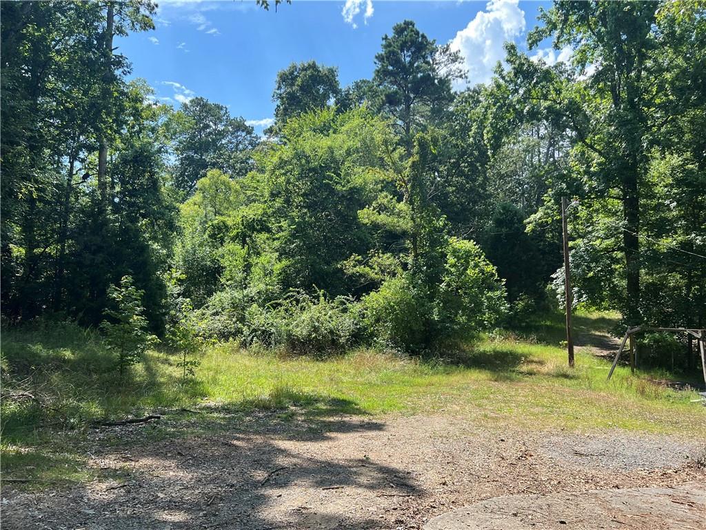 Discover the perfect opportunity with these 5 connected building lots, 3 have 180 ft *- road frontage on Wilkerson and two have road frontage on the undeveloped Beverly Road, offering plenty of space and potential. These lots are in a great location and are perfect if you're planning to build your dream home or just want to invest! One lot has a old mobile home that has had utilities in the past making it easier for your future development. *DO NOT ENTER THE MOBILE HOME* Buyers will need to conduct their own inspections during the due diligence period. No mobile homes allowed. Selling AS-IS
