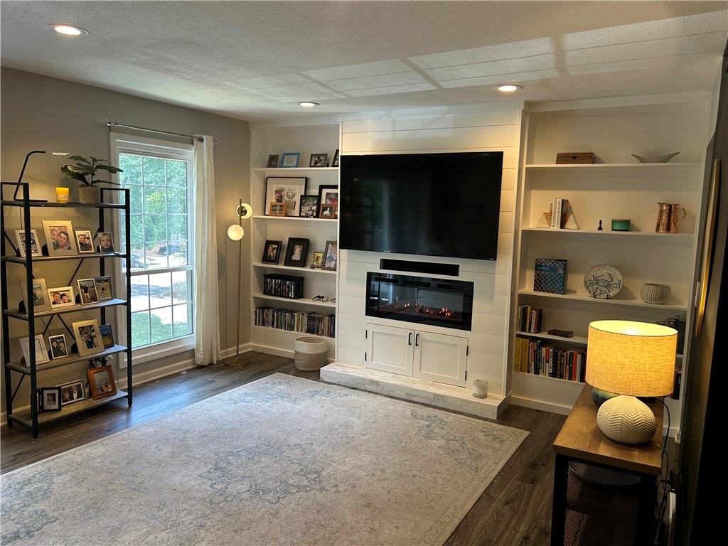 Welcome to Foxcroft Condos, nestled in the vibrant heart of Sandy Springs!
This spacious 2-bedroom, 2-bathroom condo blends comfort, style, and convenience in an unbeatable location.
Inside, you'll find hardwood floors throughout and large, newly installed windows that bathe the home in natural light, creating a bright and inviting atmosphere. The living area features a built-in wood shelving unit paired with an electric fireplace—perfect for cozy evenings at home.
The updated kitchen is designed for both function and style, offering ample cabinetry, stainless steel appliances, granite countertops, and a custom tile backsplash.
Retreat to the generously sized primary bedroom, complete with a luxurious ensuite bathroom featuring marble floors, a double vanity, and a walk-in shower. A second spacious bedroom and a full guest bathroom provide plenty of room for family or guests. Ample closet space throughout the unit ensures all your storage needs are met.
Step outside onto your private balcony and enjoy serene views of a lush natural tree line—ideal for relaxing or entertaining.
Foxcroft offers a range of desirable community amenities including secure parking, a swimming pool, tennis courts, and a clubhouse. Plus, you’ll be just minutes from top-rated schools, parks, shopping, dining, public transportation, and just a short drive to both Buckhead and Alpharetta.
Listing agent is a licensed real estate agent in the state of Georgia and is the owner of the property.