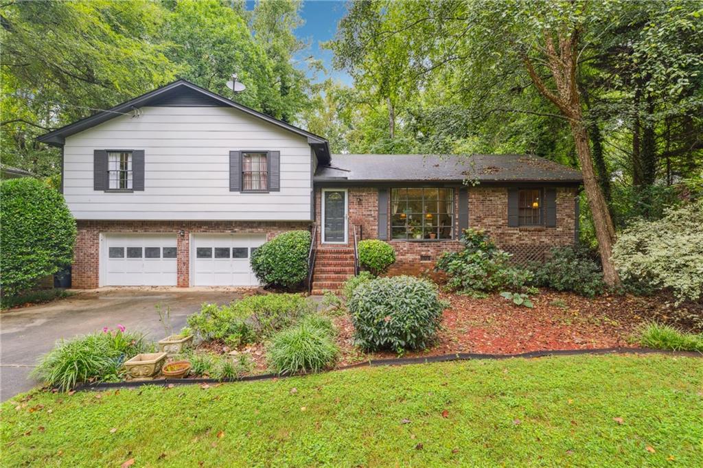 Welcome to this beautifully maintained 4-sides brick home on a quiet, private, wooded side street in the heart of East Cobb! Perfect for a first-time homeowner or investor, this property features an open floor plan, hardwoods throughout, and a functional wood-burning fireplace. With no HOA restrictions, you’ll enjoy the flexibility to make it your own. A large backyard provides plenty of room for play, pets, or entertaining, all while being close to top-rated schools, shopping, and dining.