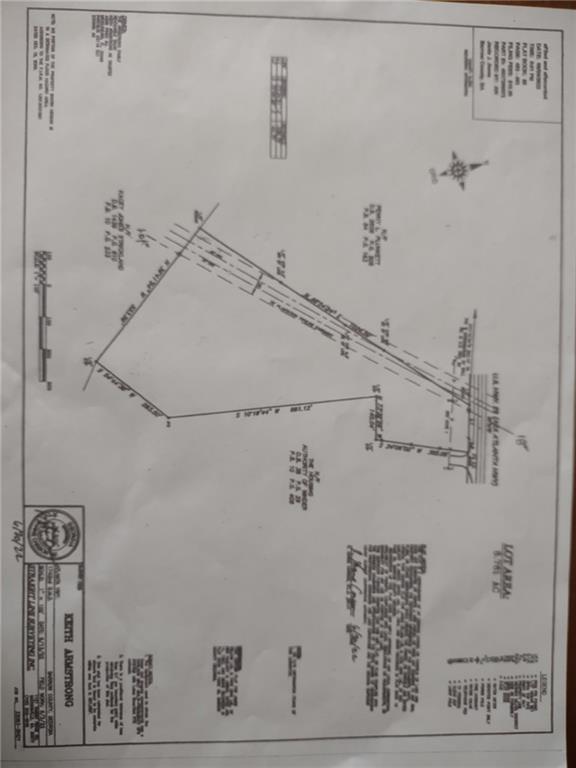 Great opportunity on this 8.76 acre lot with possible commercial zoning. Used presently for commercial enterprise in a 60 X 40 2400 Sq Ft industrial building with 3 phase electricity. With 14 X 14 drive through roll up doors. Water and sewer within close proximity. The lot has 167' road frontage on Atlanta Hwy.