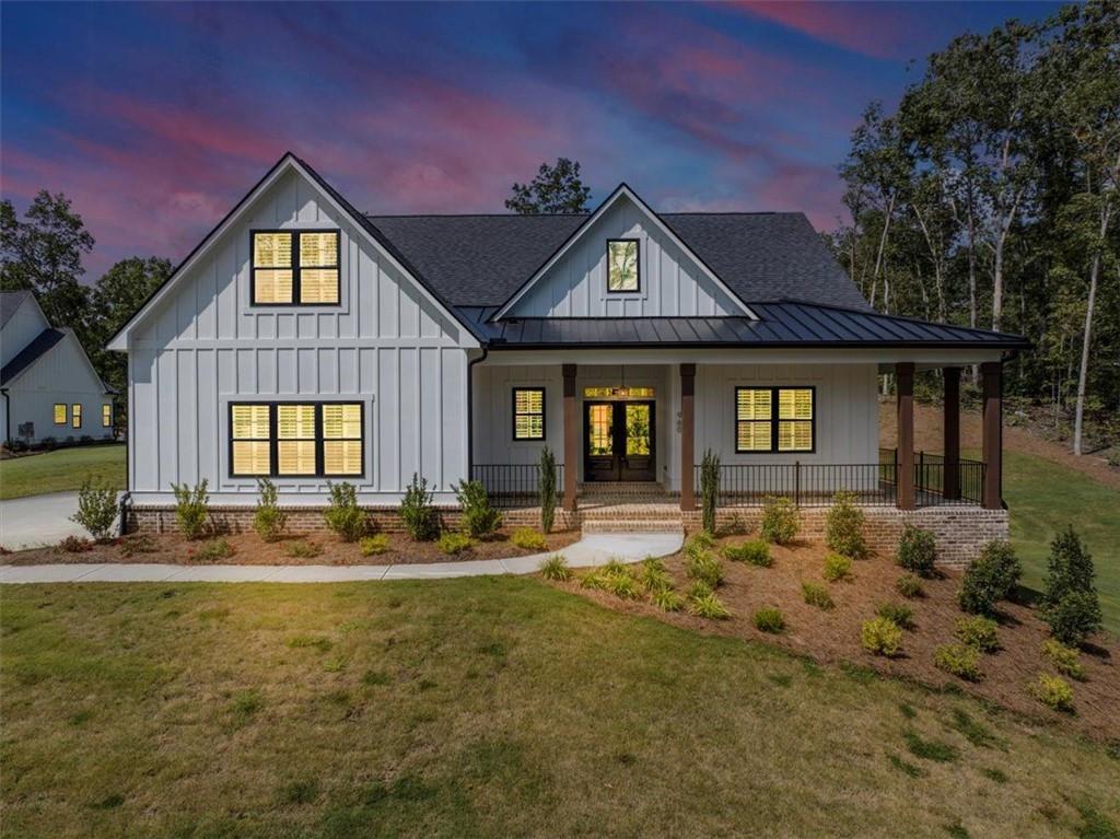 Welcome to this exceptional Ball Ground residence, where modern design meets timeless elegance. This home showcases an open-concept layout with
high ceilings, abundant natural light, and upscale finishes throughout. The chef’s kitchen is outfitted with custom cabinetry, stone countertops, and a
spacious island perfect for entertaining. A luxurious primary suite offers a spa-inspired bath and generous walk-in closet, while additional bedrooms
provide comfort and versatility. Enjoy peaceful outdoor living with a landscaped yard and plenty of space to relax or host gatherings. Ideally located
just minutes from downtown Ball Ground, parks, and top-rated schools, this property offers the perfect blend of luxury and convenience.