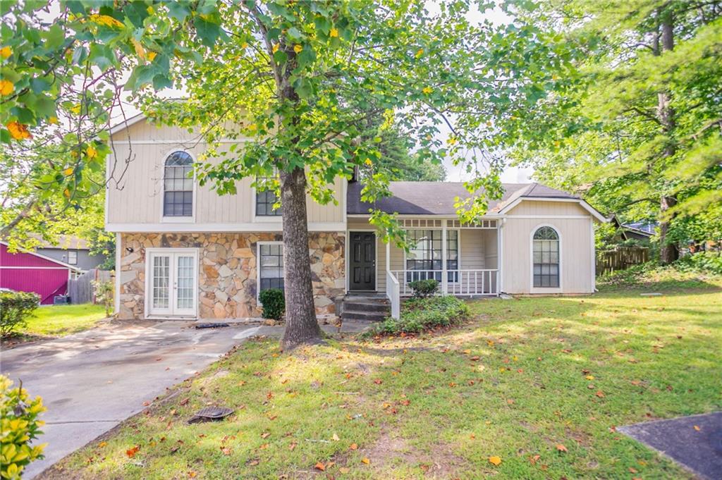 Welcome to this spacious and charming split-level home in the quiet Biffle Downs community. This 3-bedroom, 2-bath residence offers fresh interior paint, wood laminate floors, and vaulted ceilings that bring an open and airy feel to the family room. A decorative fireplace adds a cozy touch, while the bonus room downstairs is perfect for a playroom, office, or flex space. The primary suite features a private bath, and all bedrooms are conveniently located on the upper level. Enjoy relaxing on the rocking chair front porch or entertain guests on the rear deck overlooking a fenced backyard. This home combines comfort, privacy, and space—all within minutes of shopping, dining, and major highways.