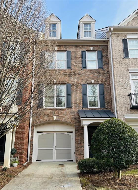 Incredible Location! Just steps away from the hottest spots in town, you'll never be short of things to do! This immaculate townhome is your gateway to Alpharetta living at its finest. Every inch of this home is stylishly appointed and features rich hardwood floors, custom lighting, heavy crown molding, luxurious trim details, and custom closets. Entrance foyer with direct access to tandem garage. Second level living space offers light-filled fireside family room with built-in bookshelves, study/office nook, and open-concept dining space conveniently situated next to kitchen with access to private outdoor living. Host unforgettable evenings in your highly appointed kitchen with granite countertops, island, stainless steel appliances, gas range, and lots of cabinet space. The bedroom level features a lovely primary suite with room for a sitting area next to wall of windows, bathroom with separate vanities, large Jacuzzi tub, and separate walk in shower. Secondary en-suite offers privacy and space to unwind. Welcome to low maintenance lifestyle! Westwood Park features a pool, fitness center, clubhouse, and greenspace. Close to The Big Creek Greenway, Ameris Amphitheatre, easy access to Avalon and downtown Alpharetta restaurants, shopping, and parks. This is more than just a home; it's a lifestyle. Ready to experience it for yourself?