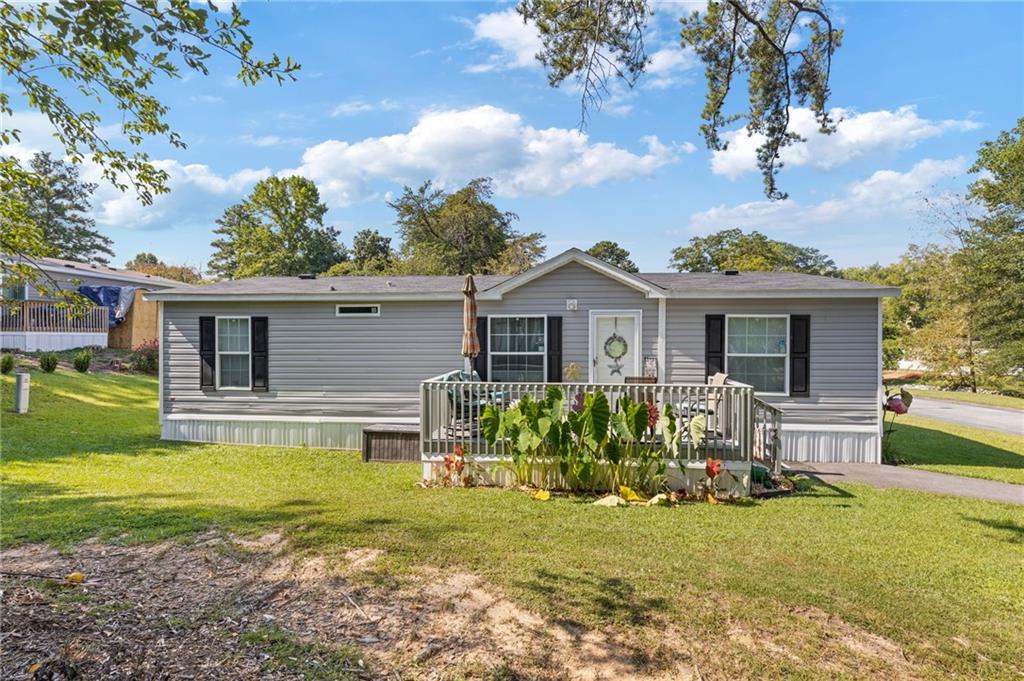 Welcome to this stunning 2023 Double-wide home, located in the highly sought after 'The Meadows Community'. The open concept living area showcases the beautiful kitchen with white cabinets, and newer appliances. You'll enjoy the roommate type floor plan with a primary bedroom with large en-suite which features a double vanity, soaking tub and over-sized shower along with 2 additional ample size bedrooms. There are two decks and a small garden, to enjoy the outdoors. A shed is also conveying with the property. The community amenities include a clubhouse, pool, lake with fish, playground & basketball court. Monthly lot fees are mandatory. Buyers must go through a background check as well as a credit check to be approved by the community, as they retain ownership of the lot. The buyer will own the home (not the land) and has the right to move the home if desired. Move-ins are on the 1st of the month only. Lot fee is $675 per month.