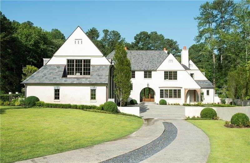 Designed by acclaimed architect Bradley Heppner, this spectacular custom home commands attention with its unique contemporary European exterior. Dramatic vaulted ceilings, arched doorways & a large expanse of windows give the interior a serene indoor-outdoor feel. Open to a fireside keeping rm, the kitchen boasts premium appliances & fixtures plus gorgeous wood accents. The lavish main level master suite & five en-suite bedrooms offer well-appointed, private rooms. Meticulously designed grounds by Bellwether are centered around a sleek stone patio & saltwater pool.