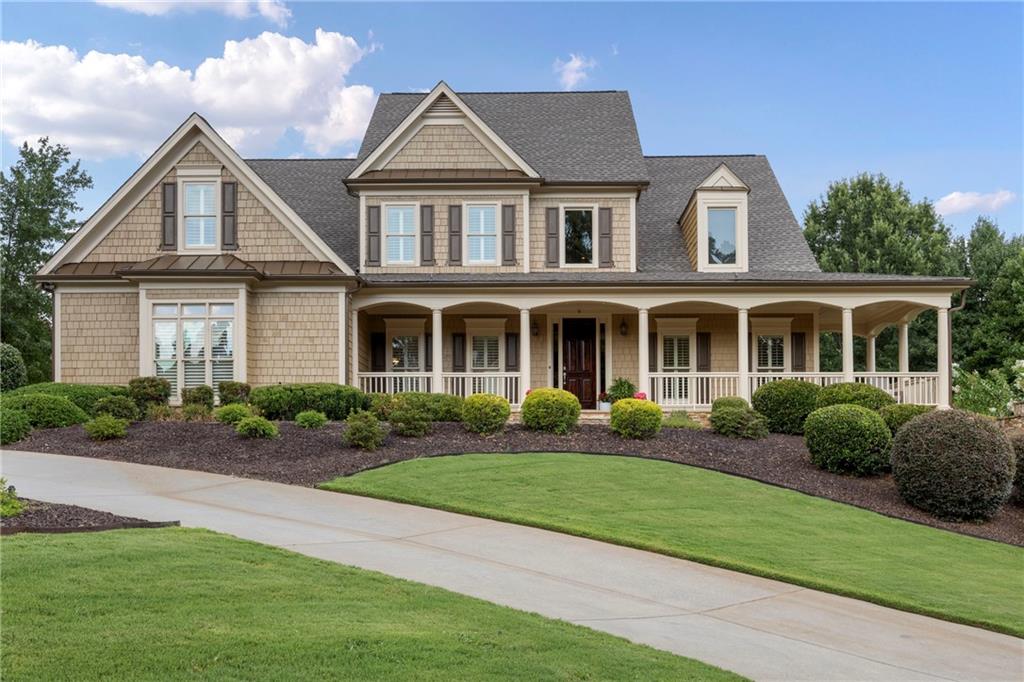 BEST CORNER LOT IN ALL OF WEST COBB!! One of the largest homes in the whole subdivision. This home offers luxury, space, flexibility, and unbeatable curb appeal—all in one of West Cobb’s most desirable neighborhoods!
This stunning 6BR / 5.5 BA luxury home sits on a premier corner lot and boasts a full finished basement. Over 6700 sf of beautifully appointed living space. Parking? No problem. Circular and linear driveway leads to a 3 car garage. You will never complain of not enough space with this home. Recent complete exterior paint. Updated roofing. Professionally landscaped with a WELL to water whenever you like, for how long you like.
Enter this home through a 8-ft tall solid wood door into the grand 2 story foyer large enough to be a room of its own. HARDWOOD FLOORING throughout the main level except the bedrooms. To the right and left of the foyer is a very spacious dining room, large enough for a 10 seat dining table, and the living room with COFFERED CEILING. Can be used as an office. Both rooms have large blade SHUTTERS and get great sunlight. ALSO ON THE MAIN LEVEL ARE THE PRIMARY SUITE AND JR. PRIMARY SUITE. 2 BRs ON THE MAIN LEVEL!!!! Perfect for guests and in-laws. The Primary suite bath has been recently updated with modern SPA features. The Jr primary suite has a trey ceiling, garden tub and separate shower bath. The open 2- story family room features bookshelves, storage, and a masonry FIREPLACE with gas starter for beautiful fire lit nights watching a movie. The family room leads out to the screened enclosed deck with enough sitting room for outside entertaining (cable outlet), and the uncovered deck.
***A CHEF's KITCHEN. All stainless steel Jenn-Air appliances. Double convection oven. 6-eye gas cooktop. Oversized range hood. Center Island is perfect for preparing and serving guests. Lots of counter space. Tons of recently updated cabinets with champagne gold fixtures and under cabinet lighting. An abundance of cabinet storage surrounds the kitchen. Granite countertops with tile backsplash. Champagne gold water fixture. Breakfast area for 4-6 people and breakfast bar that seats 3-4 people. If all the cabinets are not enough storage, there is a walk-in pantry for large appliances and food storage. From the pantry is the laundry room on the main level located at the garage door and the side exterior door.
***2nd Floor features: Wood railing with wrought iron spindles and hardwood flooring across the bridge that overlooks the 2 story family room and foyer. BR#3 is oversized with a vaulted ceiling, walk-in closet, and full bath. Big enough for a jungle gym and bunk beds!! BR#4 is a large room over the garage with a large walk-in closet. BR#5 has a walk-in closet and access to the full bath. BR#6 is on the far end of the bridge with a closet. Can be used as a BR or office.
***FULL FINISHED BASEMENT "THE MAN CAVE" This basement is an entertainer's dream. Media Room, Exercise Room, Sitting room with fireplace, Game room with BAR, Full KITCHEN, Bonus room, Full bath with shower tub combination, and Utility room. The basement features heavy crown moulding throughout. Coffered ceiling in the sitting area with a stone gas fireplace. Leads to the terrace level patio. The gaming room is large enough for any sized gaming table. Bar with sink, counter refrigerator and ice maker. Custom cabinets with granite countertops. Plenty storage for beverages and party favors. The media room is intimate with decadent trimming and surround sound system. The full kitchen is great for extra cooking space for the huge celebrations. More custom cabinets and storage galore!!! The bonus room has been used as a playroom and also as extra sleeping quarters for those extra guests. If you do not want to travel to the gym, there is plenty of space for workout equipment. The basement also has an oversized utility room to store all your lawn and utility work equipment.
