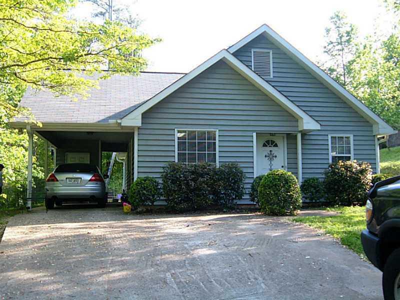 CHARMING 2 BEDROOM & 1 BATH HOME NEAR LAKE LANIER! SPACIOUS FAMILY ROOM AND KITCHEN WITH FRESH PAINT. GREAT OUTDOOR SPACE W/ CARPORT, PATIO, AWESOME YARD SPACE AND GARDEN AREA.