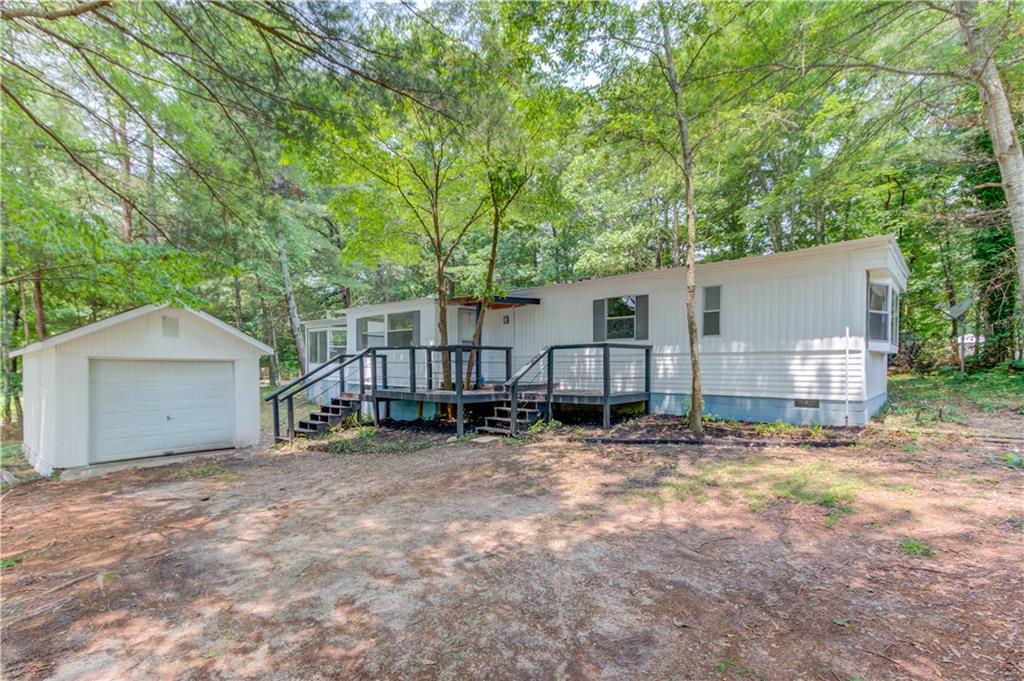 Calling all investors and savvy buyers! CASH ONLY! This is your chance to own one of the most affordable move-in ready homes in Hall County-NO HOA, a private lot, and just minutes to schools, Oakwood, and Lake Lanier public access. Whether you're looking to live in, rent out, or customize further, this 3 bed / 2 bath home has a ton of upgrades already done for you: Fresh interior & exterior paint Brand new kitchen cabinets, flooring, and subfloor Updated plumbing, light fixtures, and electrical (including new meter & box) Two beautifully renovated tile bathrooms with new vanities, toilets, faucets & fixtures New interior wall panels, door handles, and deck railing Detached garage freshly painted-perfect for tools, toys, or your RV/boat Roof and AC unit recently inspected and cleared. Don't miss this rare opportunity to own a solid, upgraded home in a prime location-value like this won't last long!