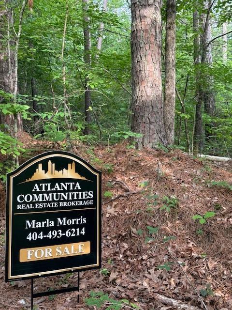 PRIVACY at it’s best, come build your private estate on this beautiful 2.38 acre lot right off of Hwy 61 and in the sought after North Paulding High School District. Live among the wildlife that also includes a creek along the back side of the property. Very convenient to family amenities like Burnt Hickory Park, Lake Point Sports Complex, and downtown Dallas. The city of Cartersville is also a short drive away with tons of shopping, entertainment and restaurants. Tract is gently rolling and would be a great basement lot. There are already several high-end estates along Narroway Trail, no HOA, and did I say how very private this Tract is? Narroway Church Spur road will be completed for ingress/egress off of Narroway Church Road once there are plans to develop any of the several tracts on this county road. NOTE: Buyer is responsible for conducting survey, soil test, perc test and to verify any concerns with the county. If you want to build, please verify needed information from the county. The new water reservoir is nearby, so water hook up might possibly be available now or in the near future.