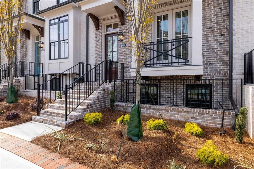Summer of Savings at Towns on Thompson! MOVE-IN-READY and  FINAL OPPORTUNITIES NOW! $35k ANYWAY HAS BEEN USED TO REDUCE THE PRICE OF THE HOME FOR CONTRACT WRITTEN IN JUNE - You may choose to use it a different way!!! Step into luxury living at Towns on Thompson, a boutique community perfectly situated between Avalon and Downtown Alpharetta. This impeccably curated townhome features 10-foot ceilings on the main level, wide-plank hardwood floors throughout, and a sophisticated palette of high-end finishes and custom details. Designed for discerning buyers, the open-concept layout blends timeless elegance with modern functionality. The heart of the home is a chef’s kitchen equipped with GE Café appliances, an industrial slide-in gas range, and a stainless steel vent hood. Bright white stacked cabinets stretch to the ceiling, paired with polished Cambria Inverness Frost quartz countertops and a striking white chevron tile backsplash laid to the ceiling. The oversized island showcases a dramatic waterfall edge, finished in Creekstone cabinetry to complement the beverage center and floating shelves, all stained to match the hardwood floors and fireplace mantle. Luxe gold hardware, a farmhouse sink, and statement Aged Iron pendant lighting add warmth and depth to this stunning space. The open living and dining area includes a built-in beverage center with a wine fridge and quartz countertop, ideal for entertaining. The spacious family room features a sleek 42-inch ventless fireplace with a floor-to-ceiling white shiplap surround, creating a warm and inviting focal point. On the terrace level, a private bedroom suite with full bath offers flexible space for guests or multigenerational living. Upstairs, the luxurious owner's suite features an expansive sitting area, custom closets, and a spa-like bath with a massive walk-in shower, complete with a drying area, rain showerhead, and Champagne Bronze fixtures. Dual vanities in Creekstone cabinetry are topped with Cambria quartz and accented by framed circular mirrors. Secondary bedrooms each feature ensuite baths with coordinating finishes and marble countertops. With only 48 homes, Towns on Thompson offers a rare opportunity to enjoy elevated living in an intimate, low-maintenance community. Located just steps from premier shopping, dining, and events at Avalon and Downtown Alpharetta, this home truly offers the best of location, luxury, and lifestyle. ~ HOA: Dues include Professional Community Management. Landscaping. Comprehensive Building & Structural Insurance. Say Goodbye to roof maintenance, gutter cleaning, painting/staining, & landscaping! Let HOA cover repair & retreat of termite bond, weekly trash & recycling and so much more! *Homeowners have the optional right to join swim amenities at the Foundry* At TPG, we value our customers, team members, and vendor team safety. Our communities are active construction zones. Please note, during your visit, you will be escorted by a TPG employee. [The Chamberlain]