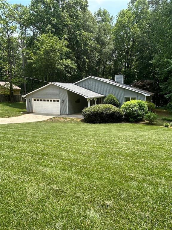 Fabulous opportunity! Check back for professional photos Friday June 5. Three bed/two bath ranch situated on private serene backyard. Enjoy the nature from your amazing deck with modern railings. The deck is perfect for grilling, eating surrounded by the rustle of the wind and sounds of nature in your private wooded back space. Fabulous large flat stone path in back and raised stone bed. A small creek runs deep in woods making for amazing privacy! It's outside living space that is tough to find! Truly a lifestyle property with loads of potential. Once you enter through the covered front porch alcove you will immediately notice the fabulous sunken great room and soaring ceilings complete with 2 skylights and open design. The large rock great room fireplace invites you further into this one level easy living home. Eat-in kitchen has been renovated to feature the beautiful sleek cabinetry, an abundance of counters, and pretty designer hardware. Bring out the inner chef in you with the gas range and stainless vent hood. Also featured: Stainless refrigerator, stainless dishwasher, and lovely easy to clean tile flooring. Eat-in area looks to the private back area. Ample size dining room and wet bar area perfect for entertaining with family and friends.
Head back to the 3 bedrooms. They are large and a wonderful private space. owners bedroom suite has new carpet, a large walk-in closet, floor to ceiling windows and an updated private bathroom. Owners bathroom features: updated sleek designer vanity and a large tile shower. The additional two bedrooms also feature the floor to ceiling windows, great closet space and are nice size rooms. Convenient laundry room near the bedrooms is a perfect size with cabinetry.
Don't miss the very large 2-car garage with attic pulldown and plenty of space in garage for lawn equipment, tool area and storage. Don't miss the electric garage opener: Just pull directly down drive as the new homeowner directly into your easy-to-pull-in garage for a fabulous easy access to main portion of home and kitchen.
The gutters are covered so there is little maintenance for gutter cleaning. The home has beautiful hardwoods and trees. Windows replaced. Roof replaced with skylights as newly added.
