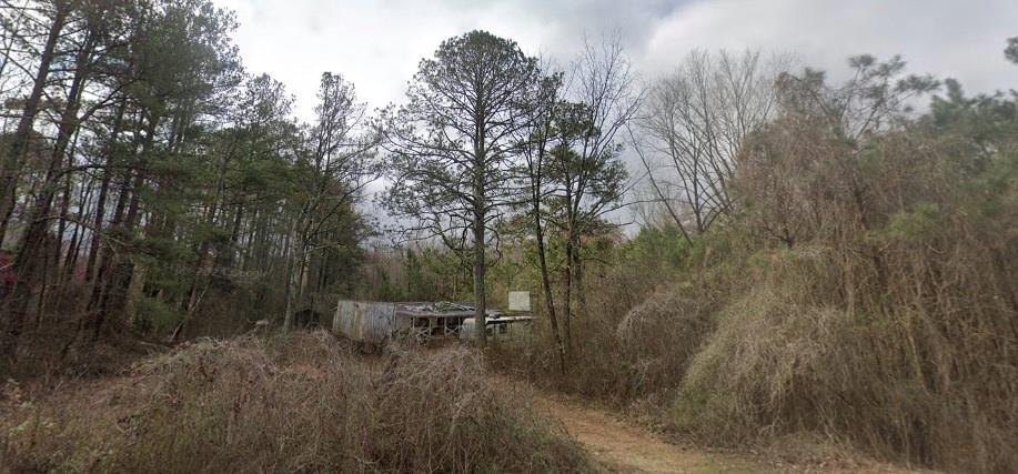 RENT TO OWN this lovely peaceful flat acreage only 3 miles from Home Depot, shopping and local favorite pubs and restaurants! Villa Rica is gaining in PPOPULARITY! The charming town at Train Junction has plenty of businesses and shopping and pubs! The House is gutted and ready for your imagination dream renovation. Some fixtures remain. This property has exclusive private use of the lovely riverfront where you can actually pan for gold like the olden days in Villa Rica the famous gold rush town or go fishing. The 6 horse barn is in excellent sturdy shape. The pool needs to be redone, but it is there waiting