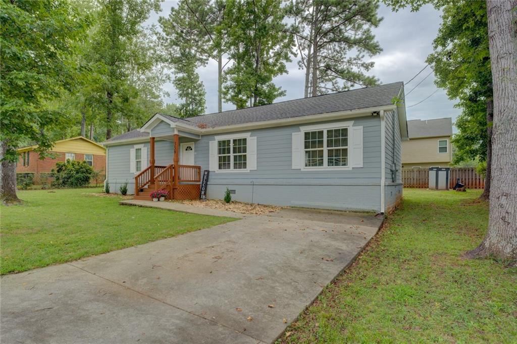 Like New and Move-In Ready 3 Bedroom, 2 full bath home rebuilt in 2022 on original foundation. Features an open floor plan with so many newer upgrades including Roof, HVAC, Hot Water Heater, flooring, carpet, lighting, bathrooms with tile, and an awesome kitchen with large center island, granite counter tops and stainless appliances! A split bedroom plan has the spacious master suite on one side of the house featuring a walk-in closet with built-ins and gorgeous master bath with a double vanity and large tiled shower. The other side of the house features 2 guest bedrooms with walk-in closets and an additional full bath. You will also enjoy the welcoming front porch and small back yard and deck. Priced to Sell! Must have appointment to see and show.