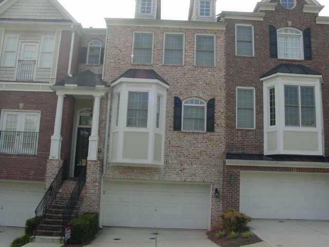 GORGEOUS EXECUTIVE TOWNHOME IN GATED COMMUNITY. ACROSS FROM GREENSPACE. BRICK EXTERIOR. LIGHT , BRIGHT AND OPEN. SUNROOM LOFT OFF OF GREAT ROOM. GREAT MARIETTA LOCATION. CONVENIENT ACCESS TO SQUARE OR KENNESTONE. BEST LOCATION IN COMPLEX WITH GREENBELT AT REAR. MUST SEE THIS!!!!