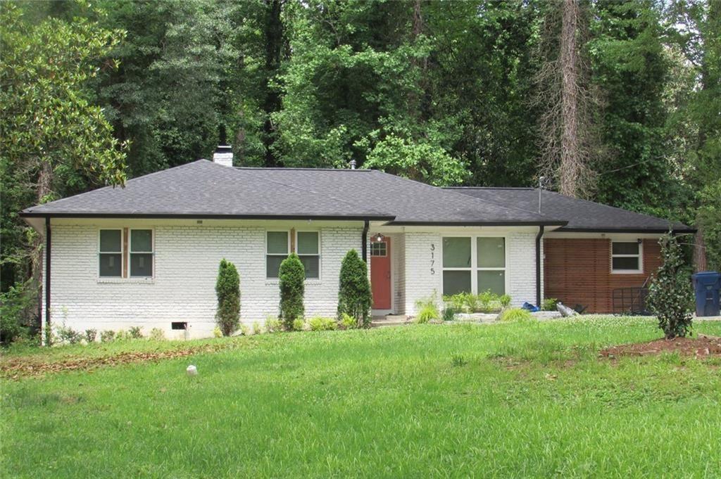 Completely Renovated Brick Ranch in Prime SW Atlanta! Welcome to this beautifully renovated 4-bedroom, 2.5-bath ranch-style home, nestled in the heart of highly sought-after Southwest Atlanta. This four-sided brick gem sits on a spacious lot with an extended driveway, a large front yard, and a generous backyard featuring a patio—perfect for entertaining or relaxing outdoors. Step inside and be wowed by the modern open-concept layout with gleaming hardwood floors throughout—no carpet anywhere. The living and dining areas flow seamlessly together, centered around a cozy fireplace that adds warmth and charm to the space. The gourmet kitchen is a true showstopper, featuring pristine white cabinetry, quartz countertops, and a large island with seating, an undermount sink, and smart appliances—including a gas stove with built-in air fryer, and a washer and dryer for added convenience. Retreat to the spacious master suite, complete with a spa-inspired bathroom boasting dual sinks, a soaking tub, and chic barn doors. Each of the four bedrooms offers ample space, natural light, and modern finishes. Enjoy peace of mind with all-new systems, including a brand-new roof, gutters, HVAC, electrical, water heater, windows, and fresh paint inside and out. This home blends style, comfort, and efficiency with smart home features and quality craftsmanship throughout. Don’t miss your chance to own this move-in-ready masterpiece in one of Atlanta’s fastest-growing neighborhoods!