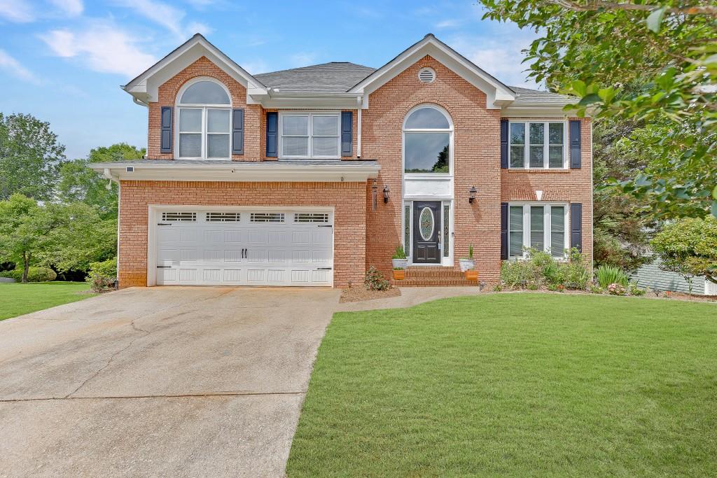 Welcome to this beautifully updated 4-bedroom, 2.5-bath home near Lake Lanier, top-rated schools, and downtown Flowery Branch. With a large flat yard, unfinished basement, and key home maintenance updates already completed, this property is ideal for a growing family looking for space, comfort, and peace of mind. Inside, you'll find a bright two-story foyer, formal living and dining rooms, and an updated kitchen with stainless steel appliances, granite countertops, and white cabinetry that opens to a light-filled family room with walls of windows. Upstairs, the oversized primary suite offers a granite double vanity, soaking tub, frameless walk-in shower, and spacious walk-in closet. Three additional large bedrooms (or optional playroom) and a generous upstairs laundry room provide everyday convenience. The unfinished basement is ready for future expansion perfect for a playroom, media room, workshop, or additional living space. Outside, enjoy a newly-built deck with stairs overlooking a flat, fenced backyard plus a flat side yard, creating ample space for kids, pets, and outdoor entertaining. Important Updates: newer HVAC, new hot water heater, replaced windows, fresh paint throughout, and new deck.