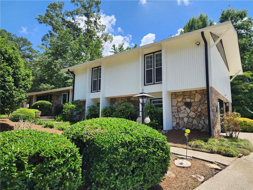 This is your opportunity to live inside of one of East Cobb's most desirable country club communities. Sought after Walton High School district as this neighborhood does not disappoint. This family home offers 4 bedrooms, large living area with lots of natural light as well as a separate den off the kitchen. Updated appliances in the kitchen, professional closet organization in most of the walk-ins, Master and guest bath have been updated. The home is situated on a spacious lot with several mature trees providing privacy as well as shade which make it easier to cool the interior and bonus...lawncare is included.