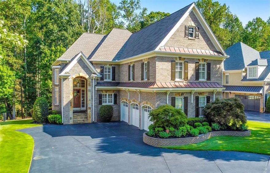 Discover the perfect family haven in a highly sought-after Marietta location! This meticulously maintained 5 bed / 4.5 bath four-sided brick and stone home sits on nearly half an acre in a quiet cul-de-sac, less than two miles from Marietta Country Club and Mount Paran Christian School. Step inside to discover a warm and inviting formal sitting and dining room, ideal for entertaining family and friends. The gourmet kitchen is a chef’s delight, featuring Jenn-Air double ovens, a brand-new six-burner cooktop, a newer Bosch dishwasher, updated refrigerator, Pacific Trusteam vent hood, and granite countertops. The elegant keeping room boasts a coffered ceiling, built-in shelves, and a gas fireplace, with a bright sunroom just off the space - originally a screened-in porch that has been thoughtfully updated for year-round enjoyment. A main-level laundry room with sink, storage, and washer/dryer adds everyday convenience. Plantation shutters throughout add timeless elegance, while upgraded wrought iron spindles accent the staircase. The oversized upper-level primary suite features soaring ceilings and a sitting room with a gas fireplace. Relax in the spa-inspired primary bath that offers vaulted ceilings, two granite vanities, a jetted tub, shower, and a spacious custom closet with two separate sections. Three additional oversized bedrooms complete the upper level, with two sharing a bath offering separate vanity areas and one featuring its own ensuite. Wood floors extend throughout the main, upper, and finished basement levels, while tile flooring enhances the bathrooms. The finished basement is an entertainer’s dream and includes a rec room with engineered wood flooring, a real brick accent wall, a bar with kegerator, wine fridge, and ice maker, plus a projector system with a screen and built-in entertainment center for the ultimate media room. This level also offers a full bath, bedroom/flex room, and ample storage. Step outside to enjoy the rear deck, covered lower patio with under-deck system, Zoysia lawn, and a charming pergola swing overlooking a serene wooded backdrop. Major component upgrades include upstairs/main HVAC replaced in 2020 with a warranty and Cool Air maintenance, and an ejector pump. A 4-zone sprinkler system and professional landscaping keep the grounds pristine. Additional highlights include a circular driveway, three-car garage, and a convenient path to the neighborhood tennis courts. This exceptional home combines comfort, convenience, and community, making it the perfect place to build lasting memories for years to come.