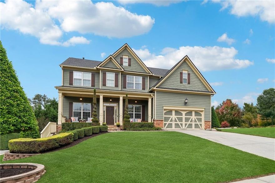 Step into a home that redefines craftsmanship and attention to detail. This beautifully updated 4-bedroom, 3.5-bath residence includes a dedicated office, flex room, and unfinished basement. Every room has been upgraded with custom carpentry, high-end finishes, and thoughtful design touches. The curb appeal is stunning, with manicured landscaping, stone pathways, tiered retaining walls, and a full-length front porch. The backyard is a private oasis, fully illuminated with professional landscape lighting. Inside, you'll find double crown molding, custom wall trim, designer light fixtures and fresh paint. The family room features custom built-ins, a stone fireplace, and built-in Sonos surround sound. The office includes custom 8' glass doors, recessed lighting, built-ins, and an accent wall with modern ceiling fan. The kitchen has quartz countertops, subway tile backsplash, refinished cabinetry with updated handles, stainless steel appliances, and under/over cabinet lighting. The flex room, currently a home gym, includes mirrored walls, recessed lighting, a ceiling fan, and a mounted TV. Upstairs, the primary suite offers a sitting area with wet bar, custom lighting, and a spa-like ensuite with dual vanities, soaking jetted tub, and walk-in closet. Secondary bedrooms feature wainscoting, accent walls, built-in closets, and updated bathrooms. Outdoor living shines with a screened-in deck, privacy lattice, and a large concrete patio offering expansion potential. The hot water heater is brand new and an architectural roof with Grade 3 shingles installed in 2023. Set in the heart of Lakestone, residents enjoy a lake with catch-and-release fishing, a swimming pool, tennis and pickleball courts, a playground, and sidewalks throughout. The location is ideal tucked between Downtown Woodstock and Downtown Roswell, with top-rated schools, shopping, and dining just minutes away. With space to grow and luxury at every turn, this one-of-a-kind home is move-in ready and must be seen in person to be fully appreciated.