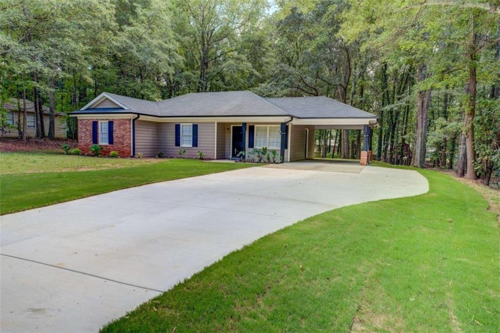 Move-in ready and beautifully refreshed! This charming 3-bed, 2-bath ranch sits on nearly an acre and has all the upgrades you've been looking for at a great price. Enjoy peace of mind with a like-new roof, all new gutters and gutter guards, brand-new water heater, new concrete driveway, fresh interior and exterior paint, updated flooring, and new appliances. Even a new septic field lines were put in just two years ago! Nestled in a quiet area with a private backyard, you'll have the perfect balance of privacy and convenience, just minutes from downtown Covington and easy access to I-20. The spacious master suite offers tray ceilings, a large walk-in closet, and a relaxing bath with separate tub and shower. Homes this updated at this price point don't last long, schedule your showing today!